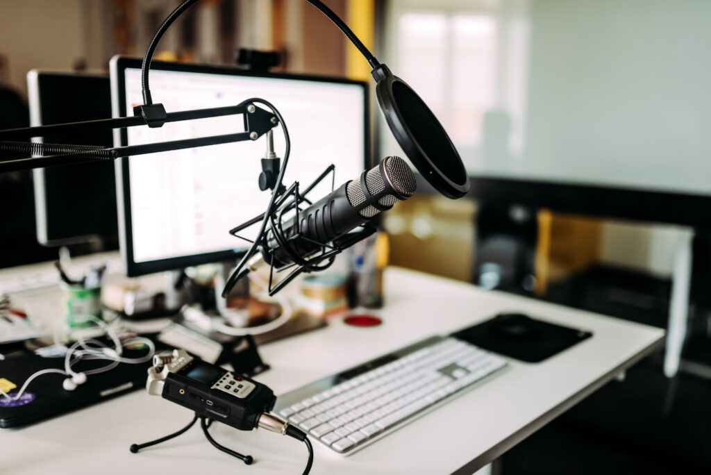 Microphone over desk in radio studio.